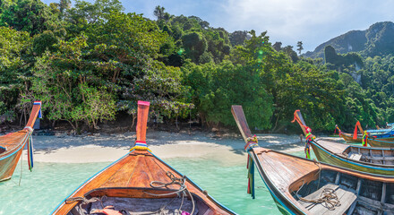 Traditional long tail boat on famous Monkey beach, Phi Phi Islands, Thailand