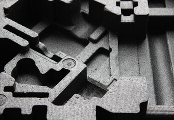 Abstract geometric three dimensional parts on a plastic foam tray