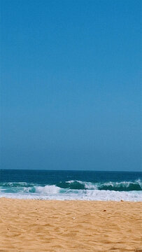 Sunlit Sand Meets Ocean