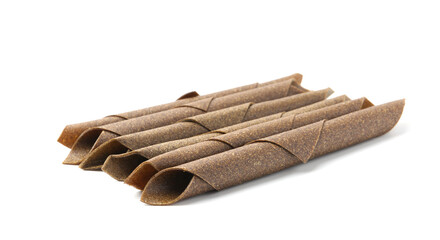 Delicious fruit leather rolls on white background
