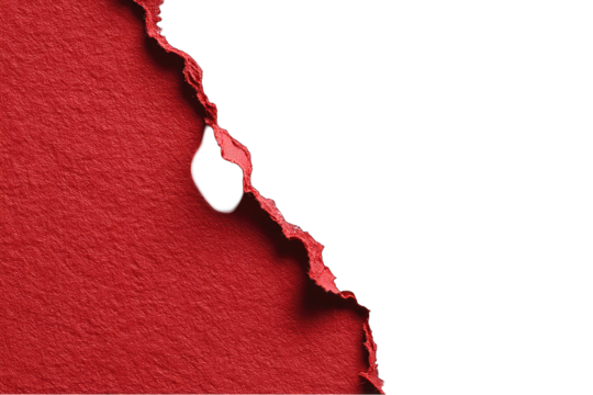 Torn red paper against black backdrop, with a hole