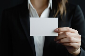 Fototapeta premium Blank business card held by professional in suit
