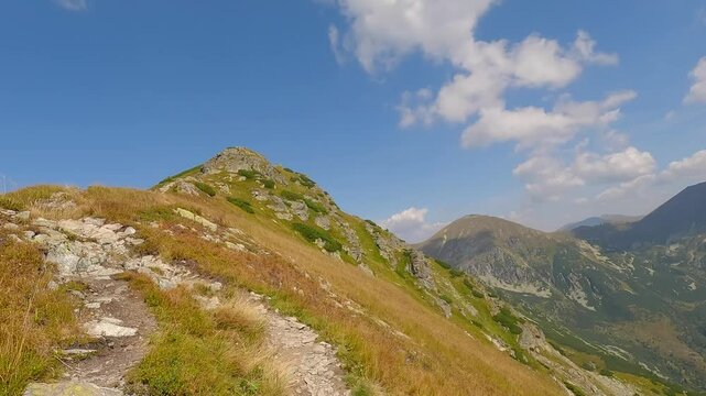 Hiking to Ostredok hill summit on Otrhance mountain ridge in Western Tatras mountains in Slovakia during beautiful summer day