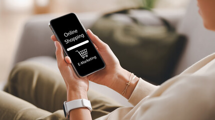 Woman using smartphone for online shopping and e-commerce at home.
