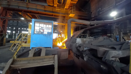 Liquid metal from a smelting furnace is poured into a ladle