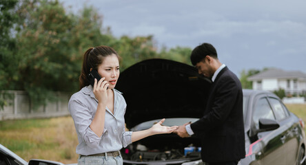 Asian woman talking on the phone asking for help in claiming insurance in case of an accident