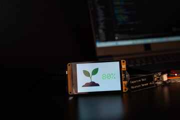 Soil moisture display screen with IoT microcontroller and soil moisture sensor, Smart farm...