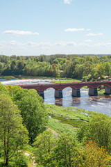 View to the Venta rapid and bridge from view tower in Kuldiga on a sunny day in May in Latvia