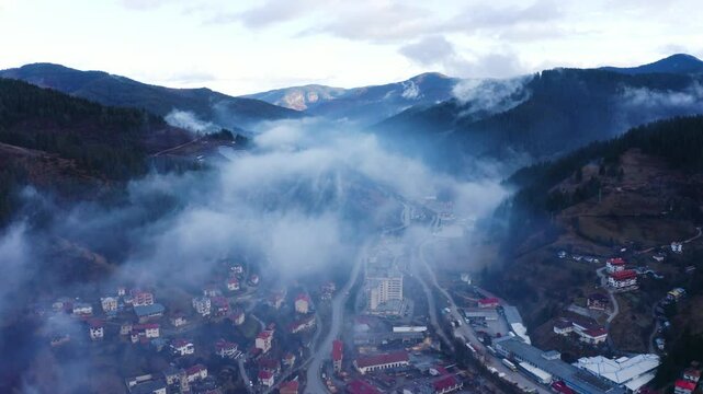 Establishing aerial footage of a small town in the mountains