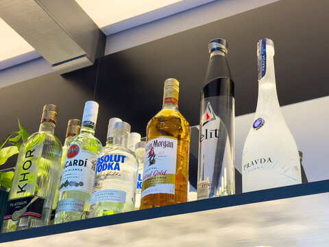 Variety of liquor bottles on display in bar shelf