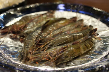 raw fresh tropical prawns shrimps on a plate