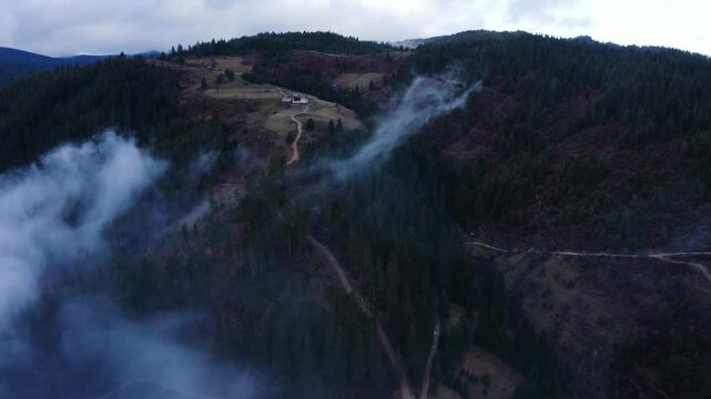 Establishing aerial footage of a small town in the mountains