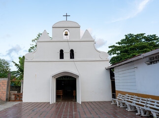 Small white Catholic church in the town of Capurgana in Chocó, Colombia