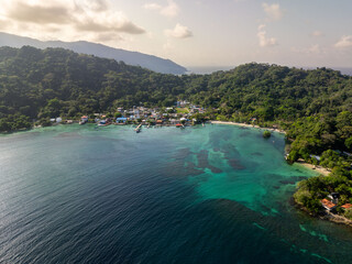 The town of Sapzurro, Choco, Colombia, and its Caribbean Sea. Panoramic aerial view with bay and landscape.