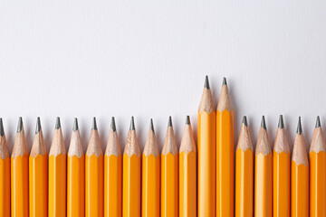 Sharp graphite pencils on light background, flat lay