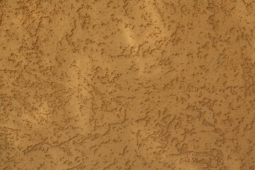 Orange textured surface as background, closeup view