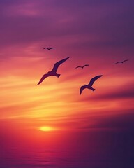 Seagulls flying at sunset over the ocean.