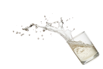 Spilled Drink: A dynamic shot of a clear glass in mid-spill, water cascading out, creating a visual splash with isolated pristine background.