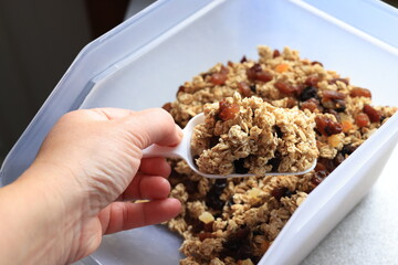 hand holding a bowl of muesli