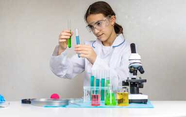 Laboratory research test tubes reagents and microscope. Selective focus.