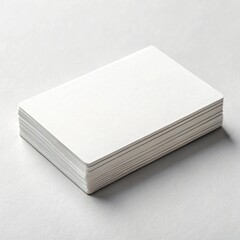 Stack of blank white cards isolated on white background, perfect for business mockup and design template, offering ample copy space