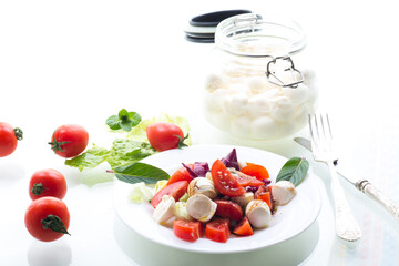 Classic Italian caprese salad for dinner, isolated on white background