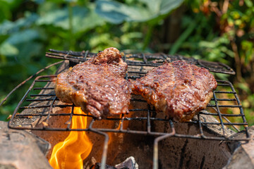 Sirloin beef grill on fire outdoor cooking