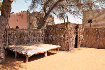 Traditional coastal emirati people house or al bait sahel, constructed from palm fronds. These...