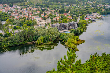 Fototapeta premium Modern Waterfront Architecture and Lush Greenery Along Pancharevo Lake in Kokalyane, Sofia Region, Bulgaria