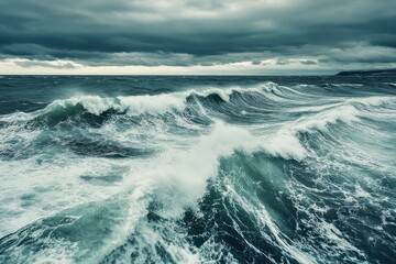 Fototapeta premium Stormy northern sea waves crashing under dramatic sky