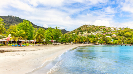 The beach of Anse a l'Ane, Trois Ilets, in Martinique, France. Anse a l'Ane is a popular beach with calm waters.