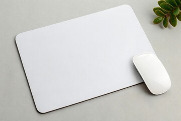 White mouse and mousepad isolated on white background with green plant, providing a clean and modern workspace aesthetic for computer accessories
