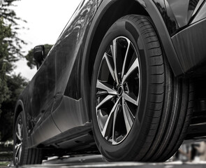 wheel with  tires tyres and aluminium rims. car parked model, in  gray black metallic color, with...