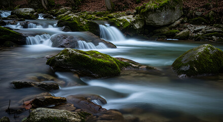 River Flowing Over Rocks with Moss