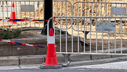 Abandoned street symphony, orange cone chorus amid silent barricades, evoking urban meditation,...