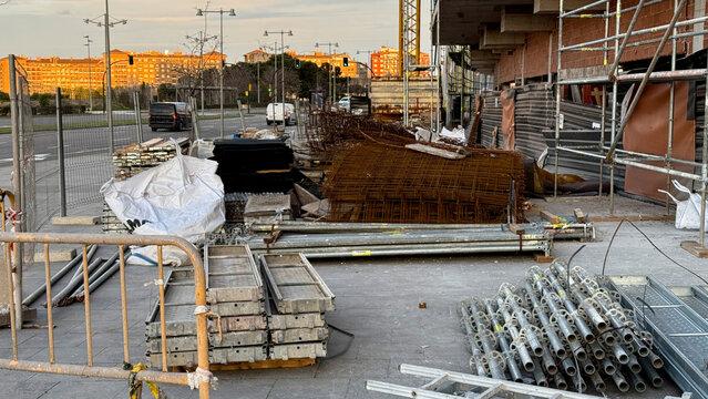 Gleaming scaffold labyrinth in dawn's golden embrace, urban renewal's heartbeat, echoing Labor Day's industrious spirit and midsummer light festivals