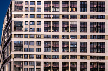 Fototapeta premium The wall of a modern urban building in close-up.Urban architecture.