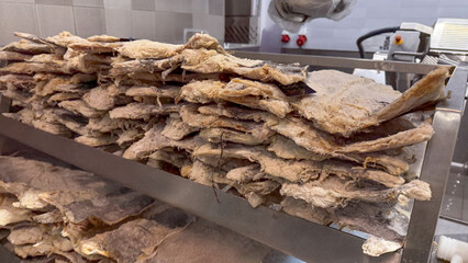 Stacks of salted codfish shimmer like maritime relics, conjuring Nordic midnight feasts and quirky...