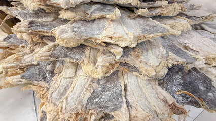 A cascade of salty dried codfish layers evokes Nordic heritage, midsummer feasts, and storied...