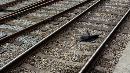 broken black umbrella, capturing urban solitude with echoes of Train Day and the Festival of Silence