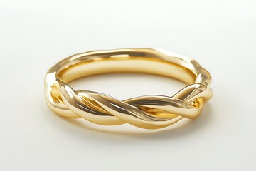 Naklejka premium Close up of a shiny gold ring with a twisted design on a white surface in a studio setting
