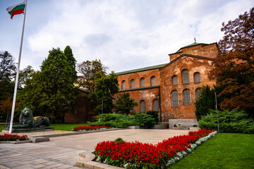 St. Sofia Church and Monument of the Unknown Soldier with Bulgarian Flag in Historic Center of Sofia, Bulgaria