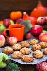 Homemade delicious apple cookies on rustic autumn background