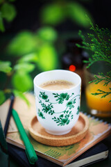 Cozy ceramic cup of cofee on spring background
