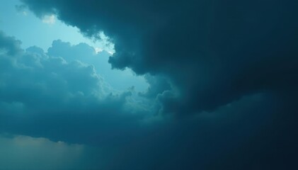 Ominous, dark storm clouds loom, heavy with rain , cumulonimbus, thunderstorm