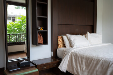 Cozy clean bedroom in tropical resort villa luxury hotel