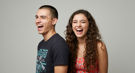Funny best friends and couple laughing cheerfully while standing together in a studio