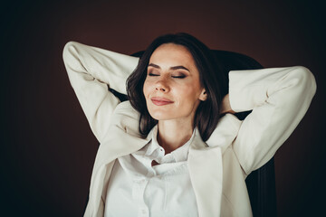 Confident businesswoman relaxing at work in a formal setting wearing professional attire with a...