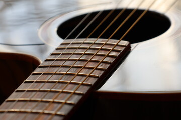Close-Up of Acoustic Guitar Strings and Fretboard.