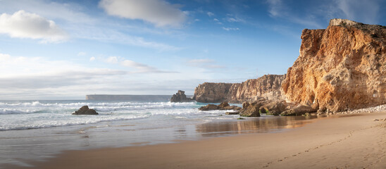 Coastal Cliffs and Tranquil Beachscape